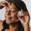 Brahmi Skincare Whistler 11:11 Magic Balm Lily's Applying To Forehead