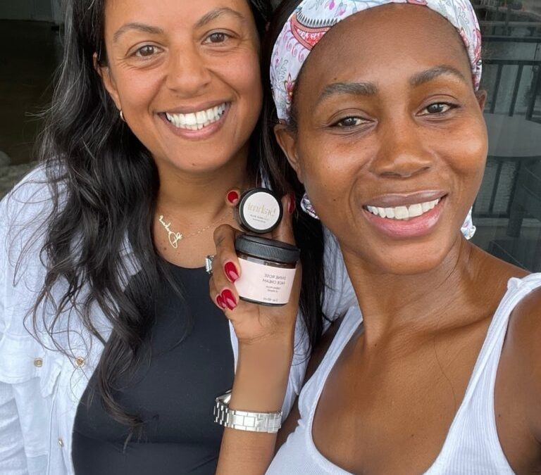 Kiki Barth Lily Chandra The Real Housewives of Miami and Miss Haiti holding Brahmi Rituals Skincare Brahmi Rituals divine rose face cream divine rose lip plumping balm